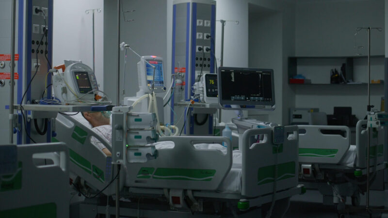 Man with oxygen mask in ICU